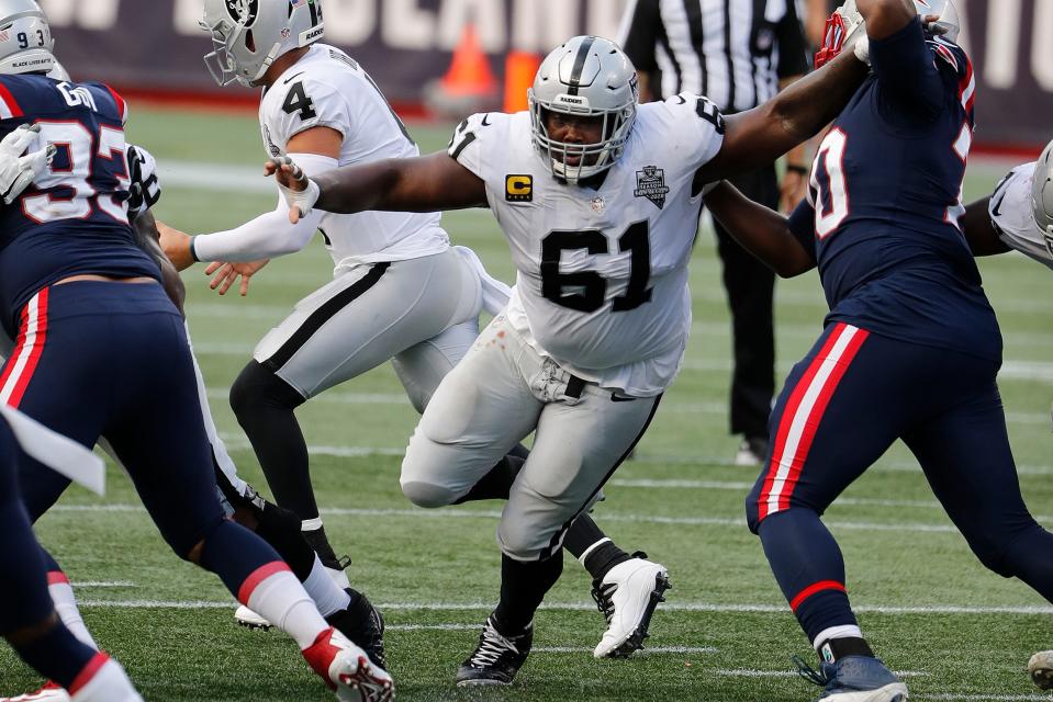 Las Vegas Raiders center Rodney Hudson blocks against the New England Patriots during an NFL football game at Gillette Stadium in Foxborough, Mass., in this Sunday, Sept. 27, 2020, file photo.