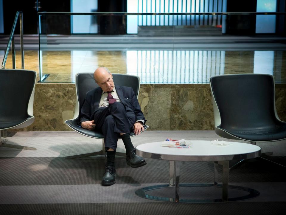 man in suit asleep sleeping