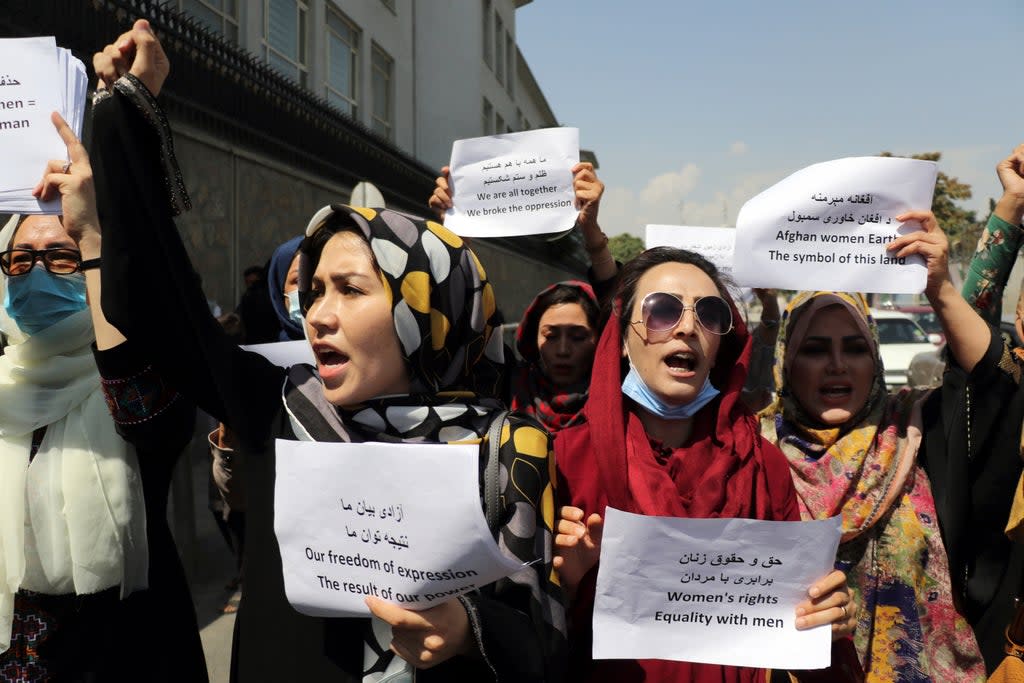 Women gather to demand their rights under the Taliban rule during a protest in Kabul, Afghanistan. (AP)