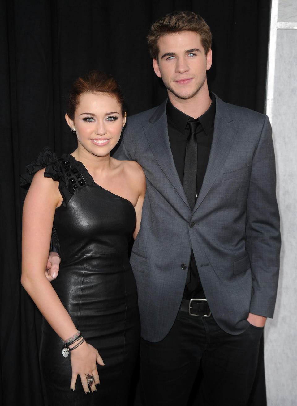 Actor Liam Hemsworth and actress/singer Miley Cyrus arrive at the "The Last Song" Los Angeles premiere held at ArcLight Hollywood on March 25, 2010 in Hollywood, California.