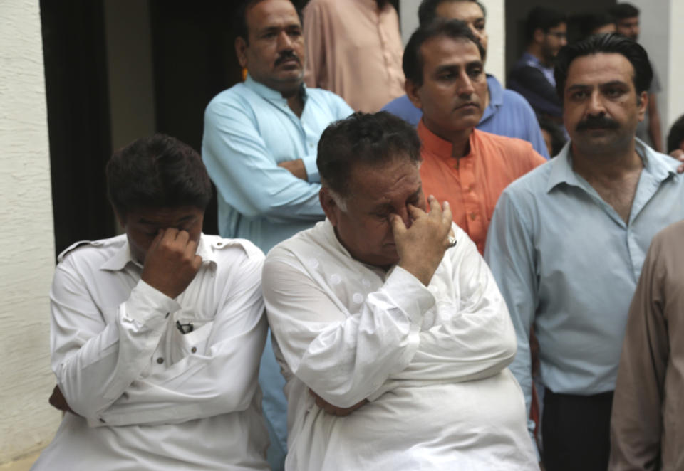 Supporters of Pakistan's former Prime Minister Nawaz Sharif mourn the death of his wife, Kulsoom Nawaz, in Lahore Pakistan, Tuesday, Sept. 11, 2018. The political party of the jailed former prime minister said Sharif 's wife died before dawn at a hospital in London on Tuesday, after months in critical condition. She was 68. Arrangements were being made to bring her body back to Pakistan for burial. (AP Photo/K.M. Chaudary)