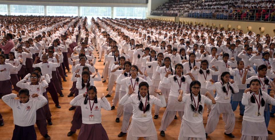 <p>Trainer and school girls participating in the self-defence combat skills during the closing ceremony of SASHAKTI an initiative of Delhi Police towards empowering school girls on December 12, 2017 in New Delhi, India. More than 4,000 girl students from all over Delhi participated at Rugby Stadium, Delhi University. (Photo by Sonu Mehta/Hindustan Times via Getty Images) </p>