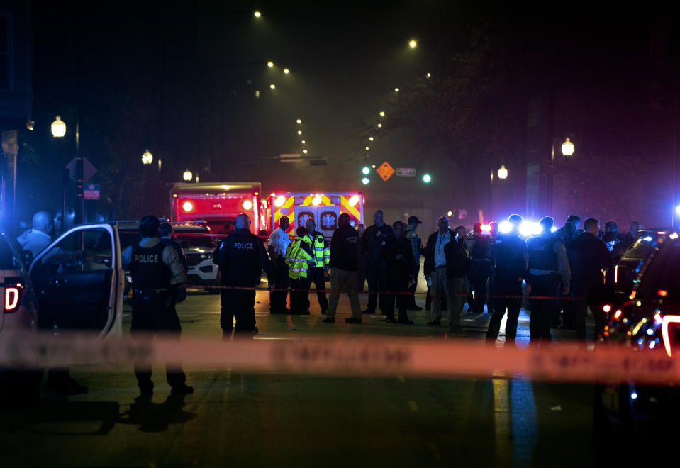 Chicago police and emergency medical responders work at the scene of a mass shooting near Polk Street and California Avenue on the city's West Side on Monday, Oct. 31, 2022. Chicago Police say several people were injured in a drive-by shooting Halloween night, including three children (E. Jason Wambsgans /Chicago Tribune via AP)