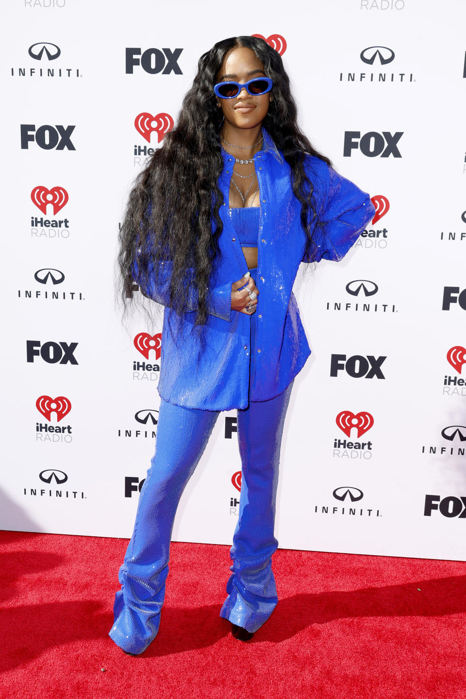 H.E.R. wearing all blue outfit. 