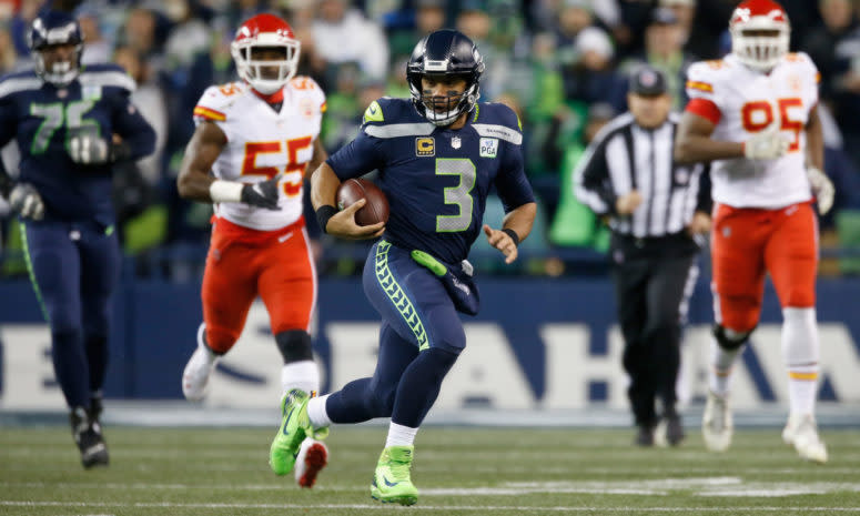 Seattle Seahawks QB Russell Wilson running with the football.