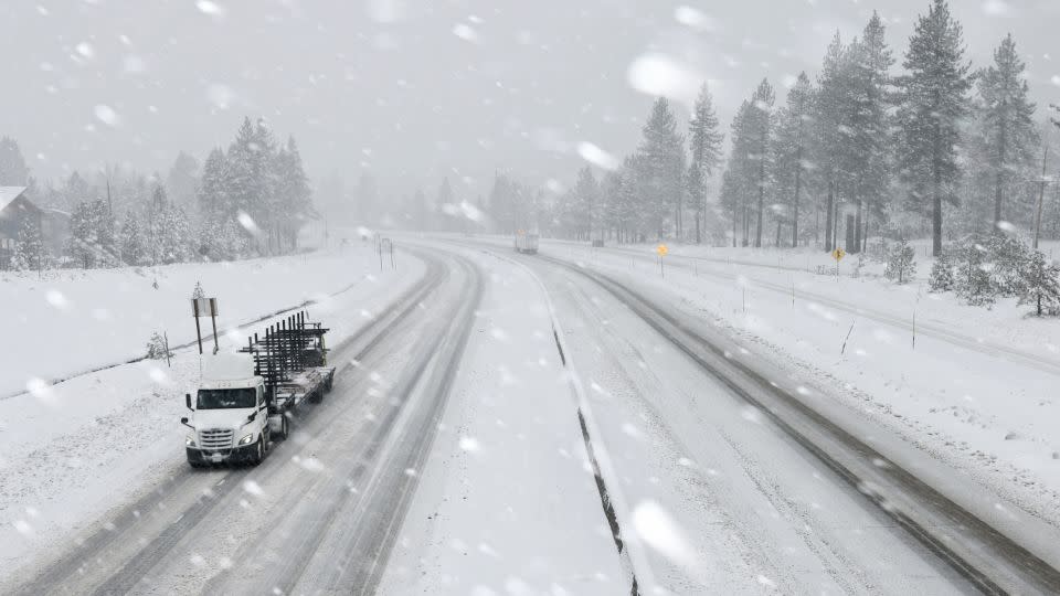 Vehicles drive on I-80 as snow hammers the region north of Lake Tahoe during a powerful winter storm on Friday, March 1, 2024, in Truckee, California. - Mario Tama/Getty Images