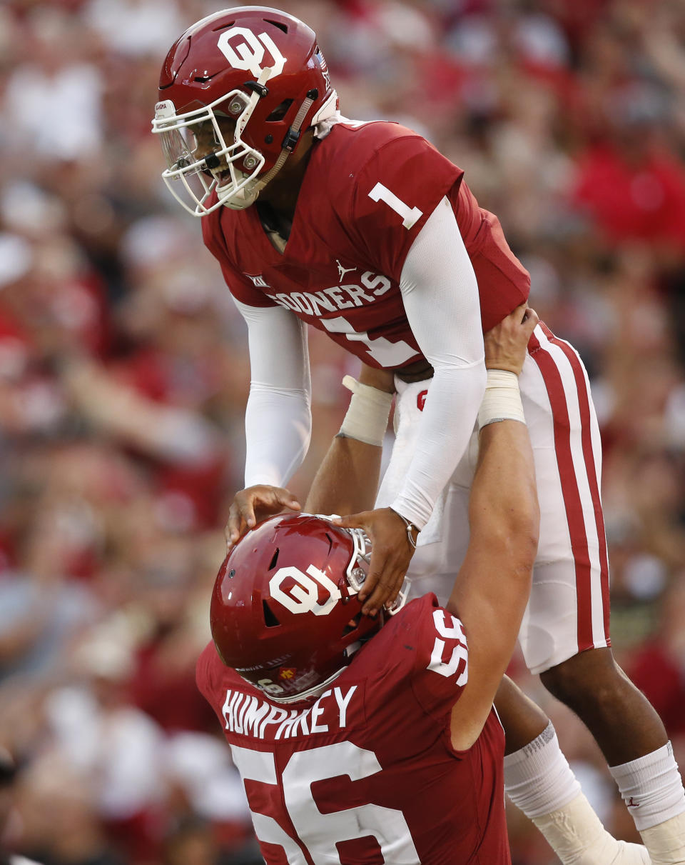 Oklahoma quarterback Kyler Murray (1) celebrates with teammate Creed Humphrey (56) after a touchdown against Army in the first half of an NCAA college football game in Norman, Okla., Saturday, Sept. 22, 2018. (AP Photo/Sue Ogrocki)