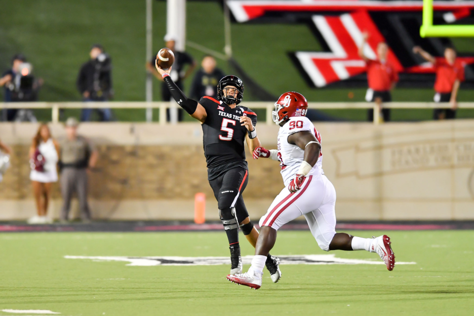 Texas Tech quarterback Patrick Mahomes throws under pressure from Oklahoma's Neville Gallimore in 2016.