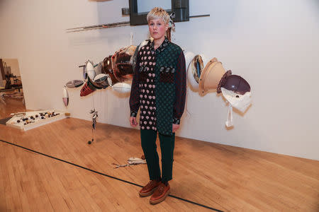 Artist Helen Marten poses for photographs with her work entitled 'Brood and Bitter Pass' after being announced as the winner of the Turner Prize at the Tate Gallery in London, Britain December 5, 2016. REUTERS/Eddie Keogh