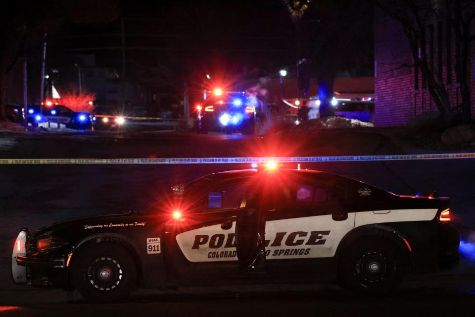 Police respond to the scene of a mass shooting in Colorado Springs, Colo., early Monday. (Kevin Mohatt/Reuters)