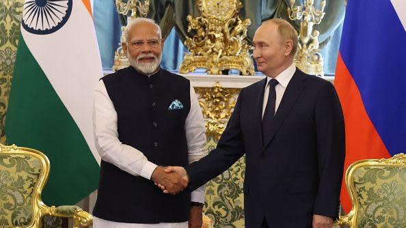 Russian President Vladimir Putin (R) greets Indian Prime Minister Narendra Modi (L) during their bilateral meeting at the Grand Kremlin Palace, on July 9, 2024 in Moscow