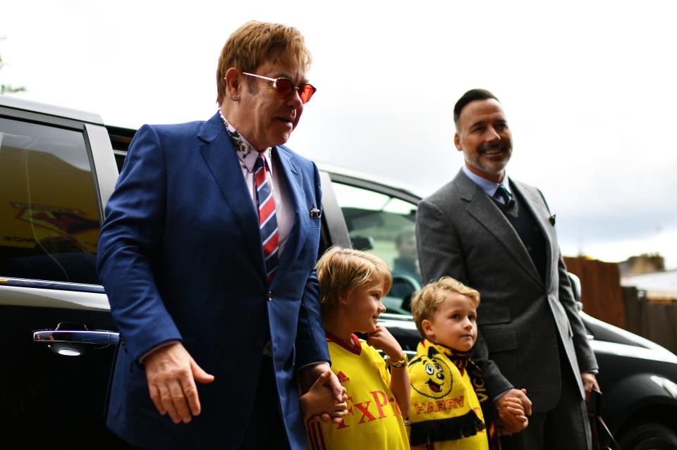 (L-R) Sir Elton John, sons Elijah and Zachary, and David Furnish