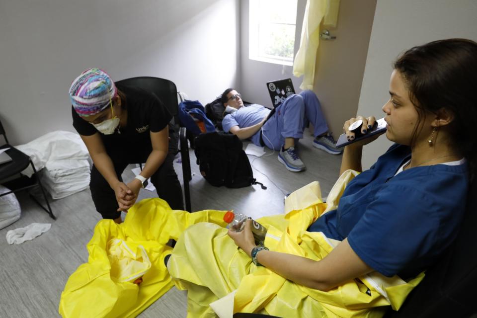 Medical students rest while on a short break from their work on the COVID-19 ward.