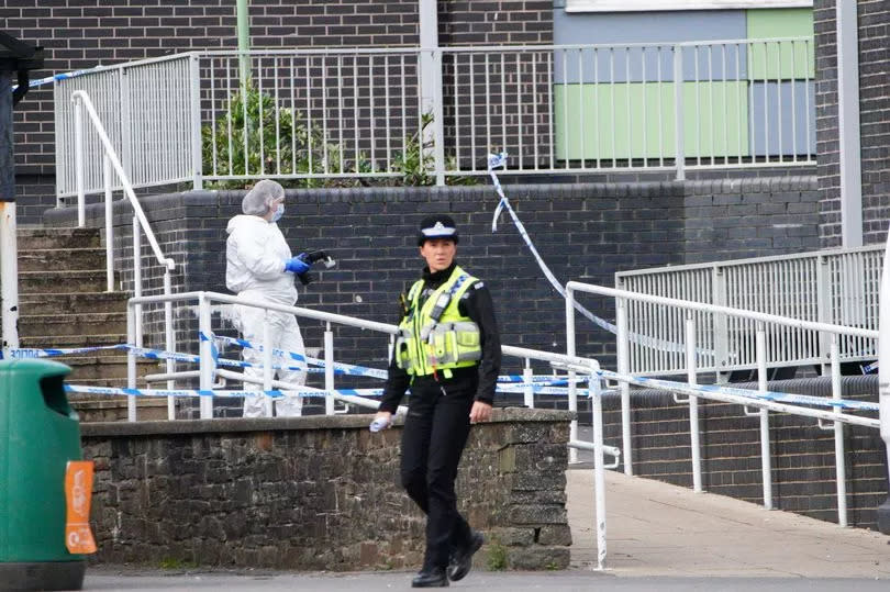 Police and Forensic investigators at Amman Valley school, in Ammanford, Carmarthenshire. -Credit:PA