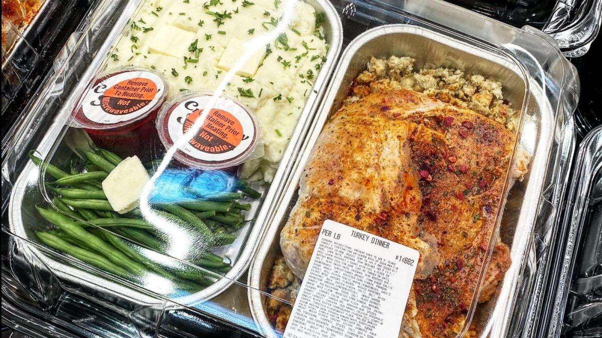 Takeout to-go containers of holiday turkey dinners with turkey