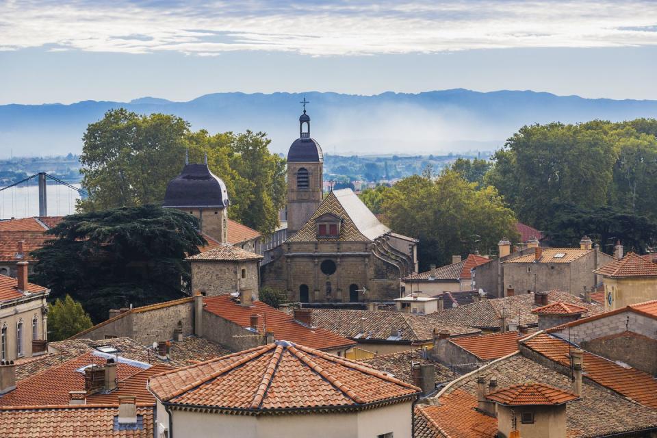 24) The town of Tournon and its church