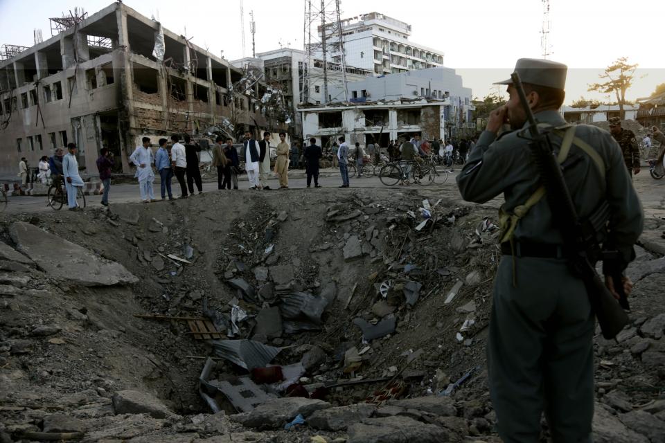 <p>Security forces stand next to a crater created by massive explosion in front of the German Embassy in Kabul, Afghanistan, Wednesday, May 31, 2017. (AP Photo/Rahmat Gul) </p>