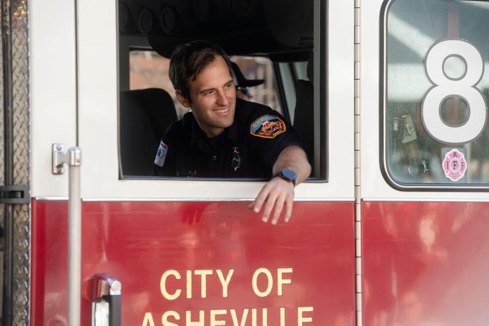 An Asheville Fire Department truck moves through the Holiday Parade, November 18, 2023.