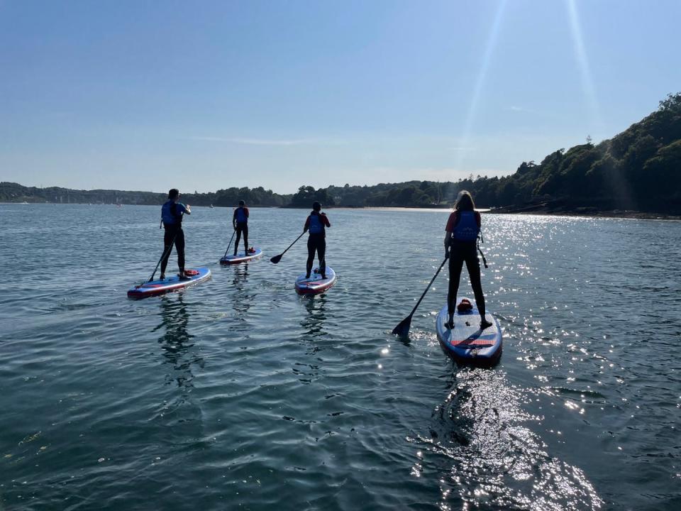 Paddleboard along the serene waters throughout both the day and night (Psyched Paddleboarding)