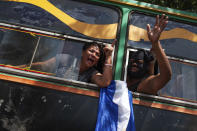 FILE - Students who had taken refuge at the Jesus of Divine Mercy church amid a barrage of armed attacks, arrive on a bus to the Metropolitan Cathedral, in Managua, Nicaragua, July 14, 2018. Cardinal Leopoldo Brenes negotiated for the safe transfer of students. The students had sought refuge in a local church after police forced them out of the National Autonomous University of Nicaragua, which had been occupied during two months of protests against the government of President Daniel Ortega. (AP Photo/Cristobal Venegas, File)