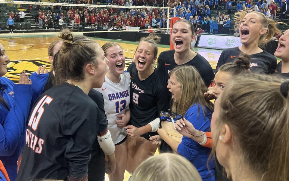 Olentangy Orange celebrates its 25-21, 25-22, 25-20 win over Toledo St. Ursula Academy in a Division I state semifinal.