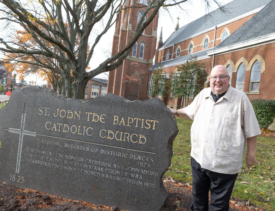 The Basilica of Saint John the Baptist will celebrate its 200th anniversary on Sunday. Canton's first Catholic Church is also one of the oldest parishes in Northeast Ohio. Rev. David Misbrener poses outside the church.