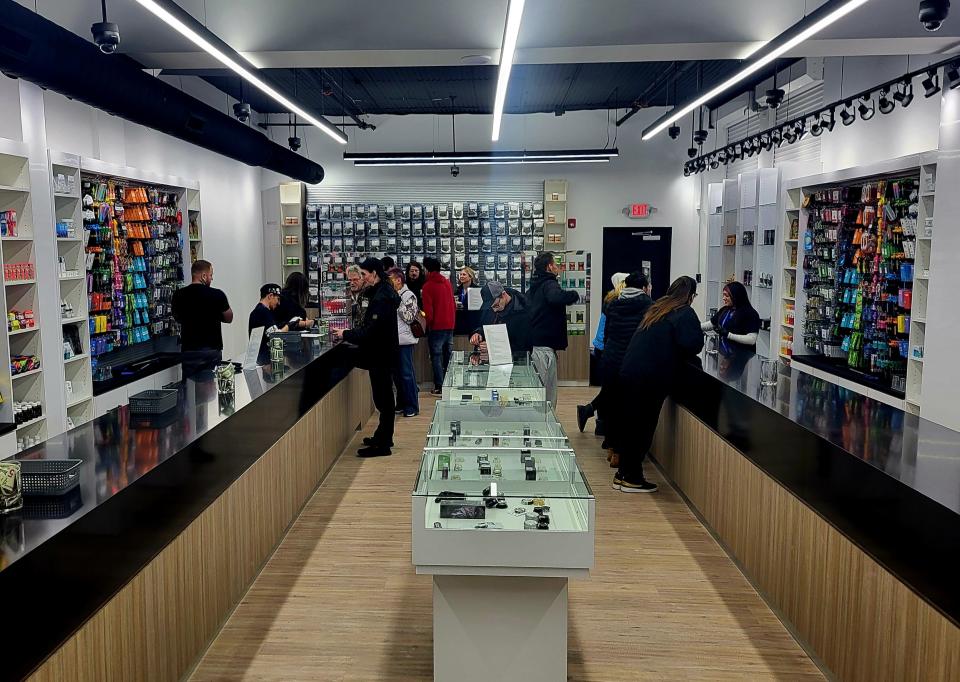 JARS Cannabis staff assist customers on the sales floor of the newly-opened retailer on Wednesday, Jan. 17, 2024, in downtown Port Huron. The business features a customer-by-customer system that escorts visitors back individually to help them make a selection.