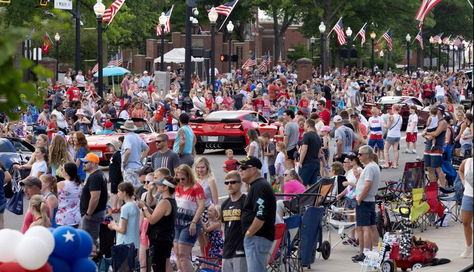 A line of Corvettes travels along South Main Street on Tuesday during the 52nd annual North Canton Fourth of July Parade.