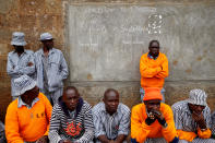 <p>Kenyan prisoners watch a mock World Cup soccer match between Russia and Saudi Arabia at the Kamiti Maximum Security Prison, near Nairobi, Kenya, on June 14, 2018. (Photo: Baz Ratner/Reuters) </p>