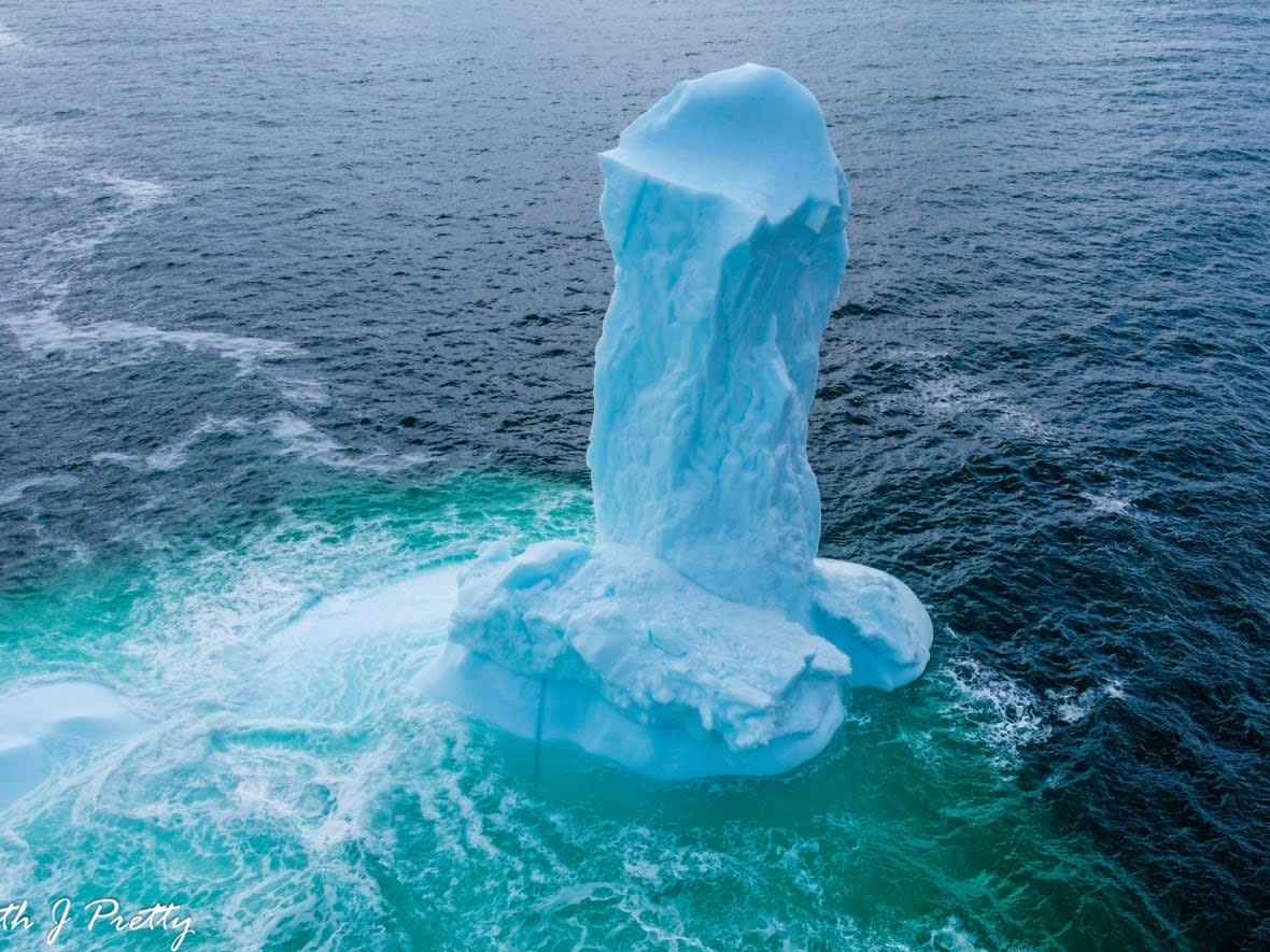 Photographer Ken Pretty spotted this strangely shaped iceberg off the coast of Harbour Grace, N.L., on Thursday. (Ken Pretty/Facebook - image credit)