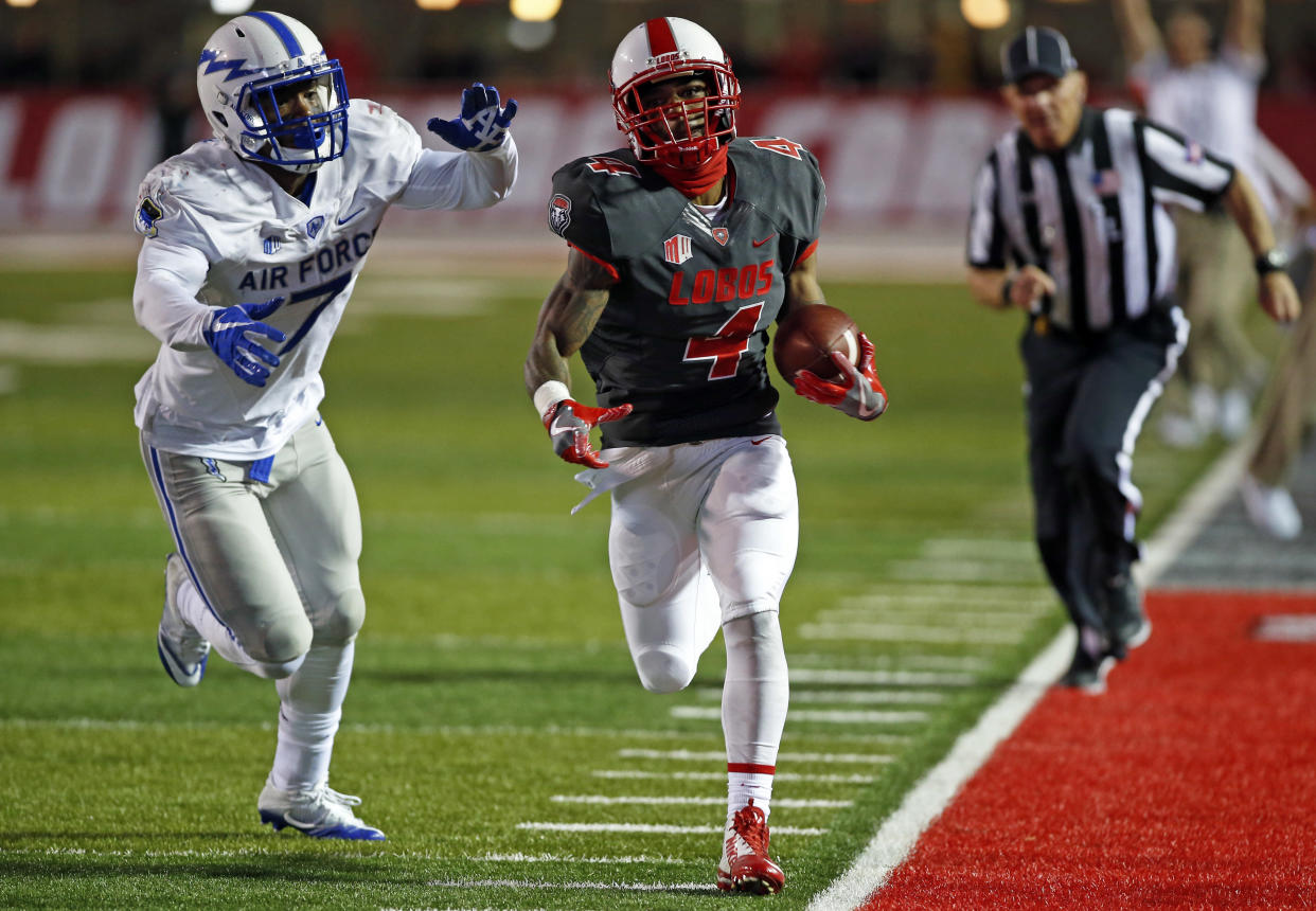 New Mexico running back Romell Jordan (4) sprints to the end zone past Air Force linebacker Ja'Mel Sanders (7) during the second half of an NCAA college football game in Albuquerque, N.M., Saturday, Sep. 30, 2017. (AP Photo/Andres Leighton)