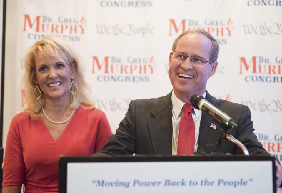 Dr. Greg Murphy speaks to supporters with his wife Wendy as he is announced the projected winner of North Carolina's Third Congressional District at the Hilton in Greenville, N.C. on Tuesday, Sept. 10, 2019. (Molly Mathis/The Daily Reflector via AP)