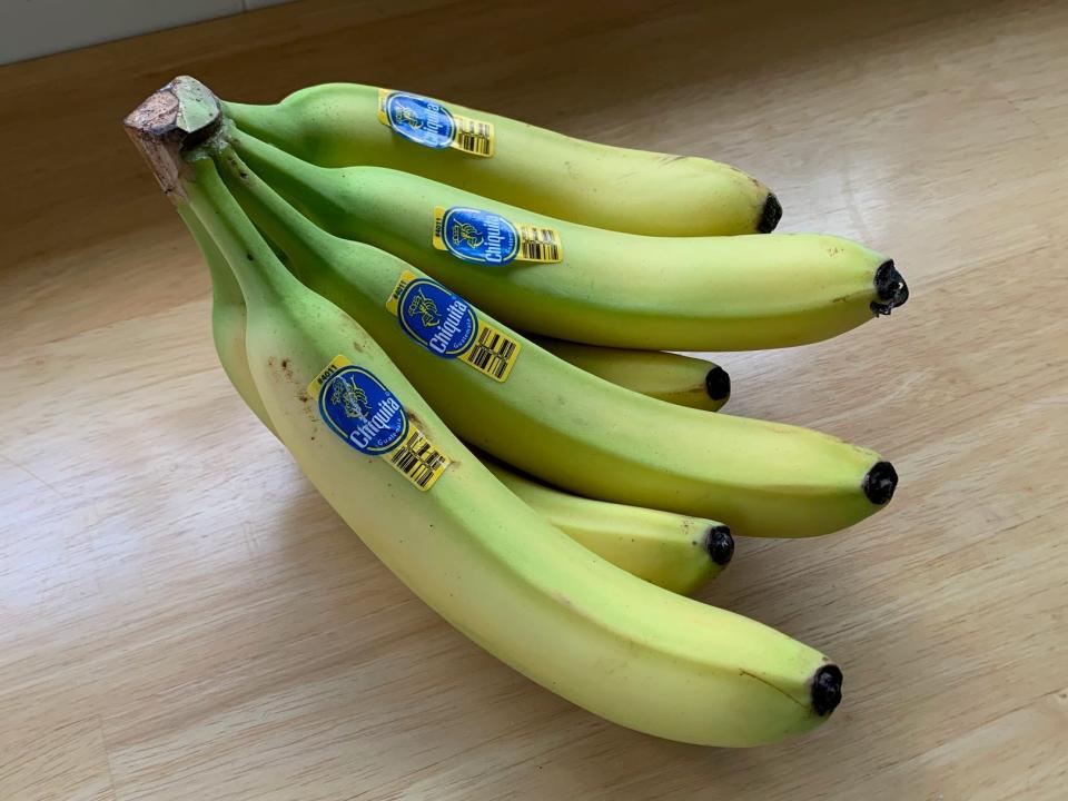 a bunch of bananas on a kitchen counter