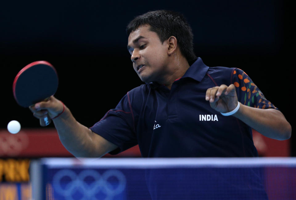 "I can't miss this!" <br> LONDON, ENGLAND - JULY 29: Soumyajit Ghosh of India plays a forehand in his Men's Singles second round match against Hyok Bong Kim of Korea on Day 2 of the London 2012 Olympic Games at ExCeL on July 29, 2012 in London, England. (Photo by Feng Li/Getty Images)