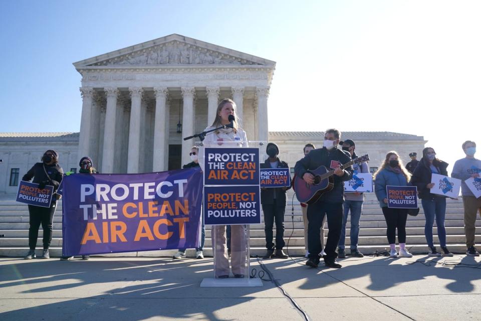 Singer Lucia Valentine performs outside as the Supreme Court hears from coal companies and their partisan allies who are trying to gut the Clean Air Act and block climate action. Barrett was suprised when she sided with the court’s liberal judge’s in the ruling (Getty Images for NRDC)