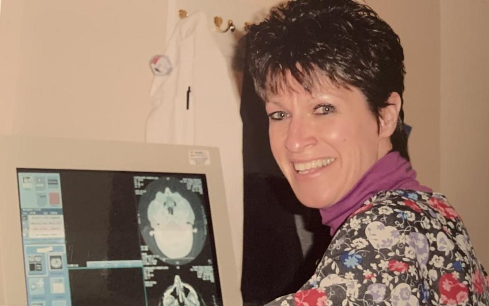 Radiologic technologist Andrea Thornley works with one of the earlier CAT scanners at South Shore Hospital in Weymouth.