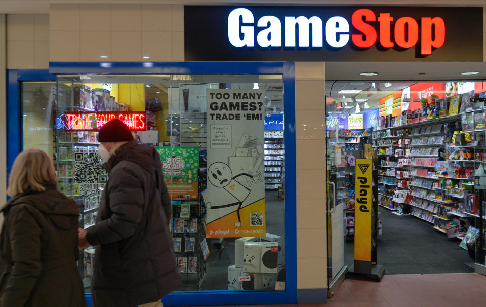 A couple walks past the entrance to the Game Stop store inside a shopping mall in Edmonton.
On Thursday, January 6, 2022, in Edmonton, Alberta, Canada. (Photo by Artur Widak/NurPhoto via Getty Images)