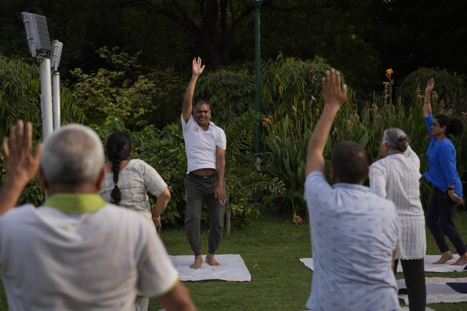 Surinder Goel, 61, conducts a yoga class early morning in a park, in New Delhi, India, Wednesday, June 14, 2023. Goel says "Our Prime Minister has done a great job in spreading yoga to the world. It was India's contribution to the world. Today, even the Muslim countries learn and follow it, only because of the PM,". He also believes yoga "is the only medium of fitness that has been there for thousands of years" and Modi's dedication towards it merits more participation from the people. (AP Photo/Manish Swarup) "Our Prime Minister has done a great job in spreading yoga to the world. It was India's contribution to the world. Today, even the Muslim countries learn and follow it, only because of the PM," says New Delhi's Surinder Goel, a 61-year-old instructor who rises before dawn and practices yoga daily. Goel believes yoga "is the only medium of fitness that has been there for thousands of years" and Modi's dedication towards it merits more participation from the people.