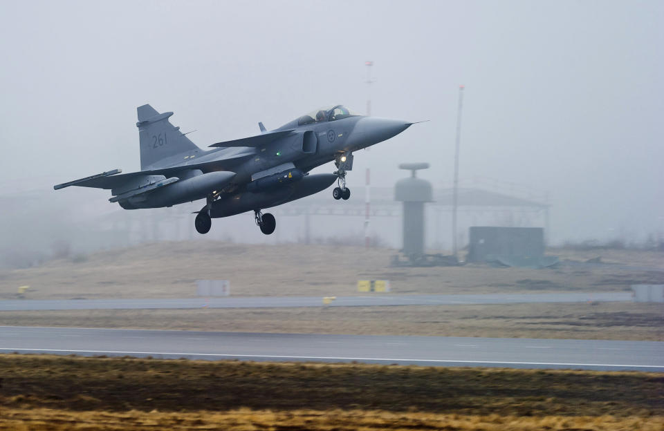 FILE - One of three Swedish Air Force JAS 39 Gripen fighter aircraft takes off from the Blekinge Wing F17, based in Kallinge southern Sweden for a base in Sardinia to join the Nato-led operation in Libya, on Saturday, April 2, 2011. As Sweden joins NATO, it bids a final farewell to more than two centuries of neutrality. (AP Photo/Scanpix/Patric Soderstrom, File)