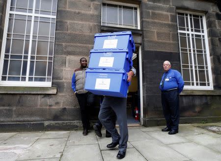 Ballot boxes are carried from New Parliament House on their way to polling stations in Edinburgh, Scotland, September 17, 2014. REUTERS/Russell Cheyne