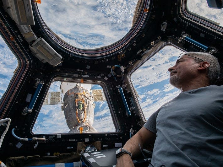 Vande Hei peers at the Earth below from inside the seven-windowed cupola, the International Space Station's window to the world.