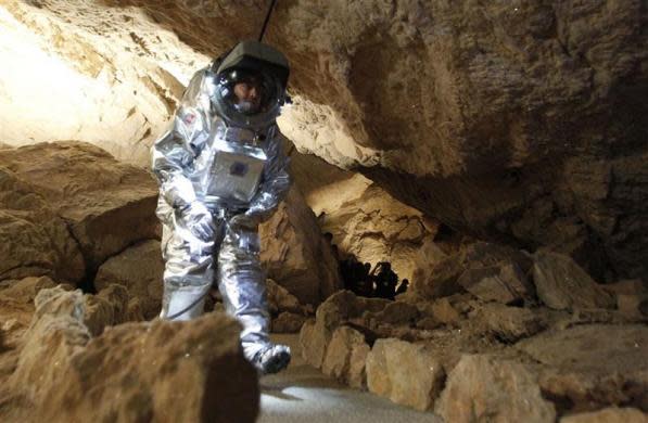 Physicist Daniel Schildhammer wears the Aouda.X spacesuit simulator during a field test of Oesterreichisches Weltraum Forum (Austrian space forum) inside the Eisriesenhoehle (giant ice cave) at Dachstein mountain near the village of Obertraun April 28, 2012. The Aouda.X is a spacesuit simulator for manned missions to Mars, which is being developed under the Mars Analog Research Program PolAres and allows to simulate environmental conditions, a real space suit would be faced on Mars.