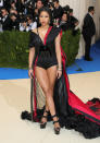 <p>The singer wore a black bodysuit and red cape ensemble with a unique belt featuring Rei Kawakubo’s face. (Photo by Neilson Barnard/Getty Images) </p>