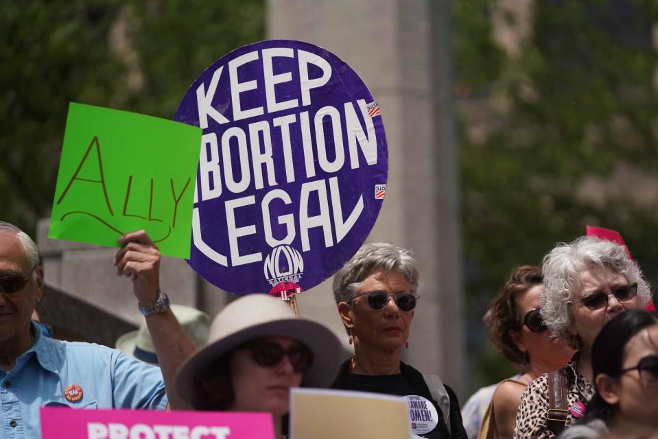 Supporters of #stopthebans rally in Rodney Square Tuesday afternoon at a protest hosted by the ACLU of Delaware. They were protesting a new wave of extreme bans on abortion and attempts to gut Roe v. Wade.