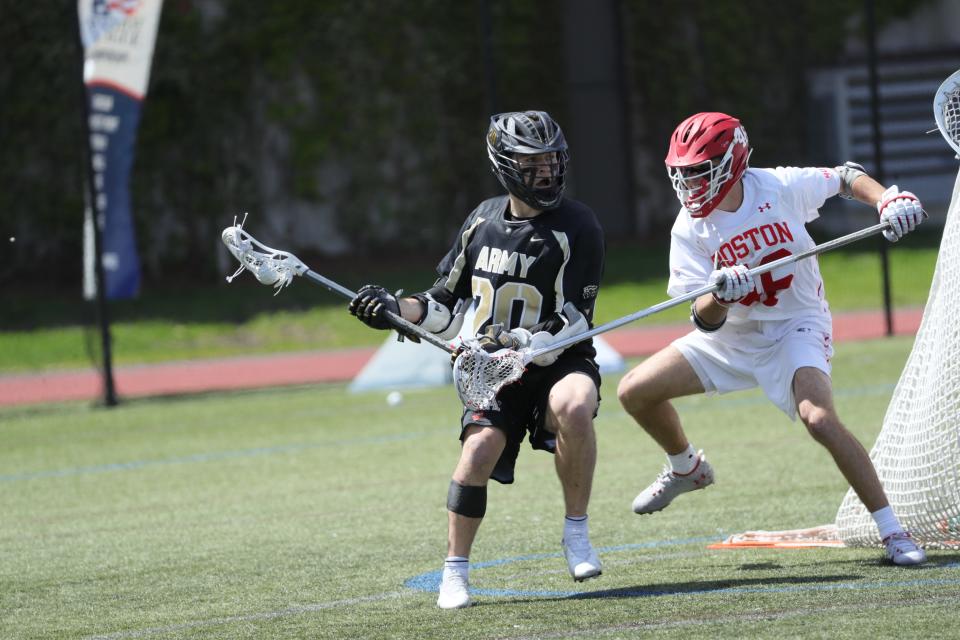 Army's Brendan NIchtern (20) works against a Boston University defender on Sunday. ARMY ATHLETICS