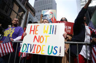 <p>A protester holds up a “He will not divide us” at the “I am a Muslim too” rally at Times Square in New York City on Feb. 19, 2017. (Gordon Donovan/Yahoo News) </p>