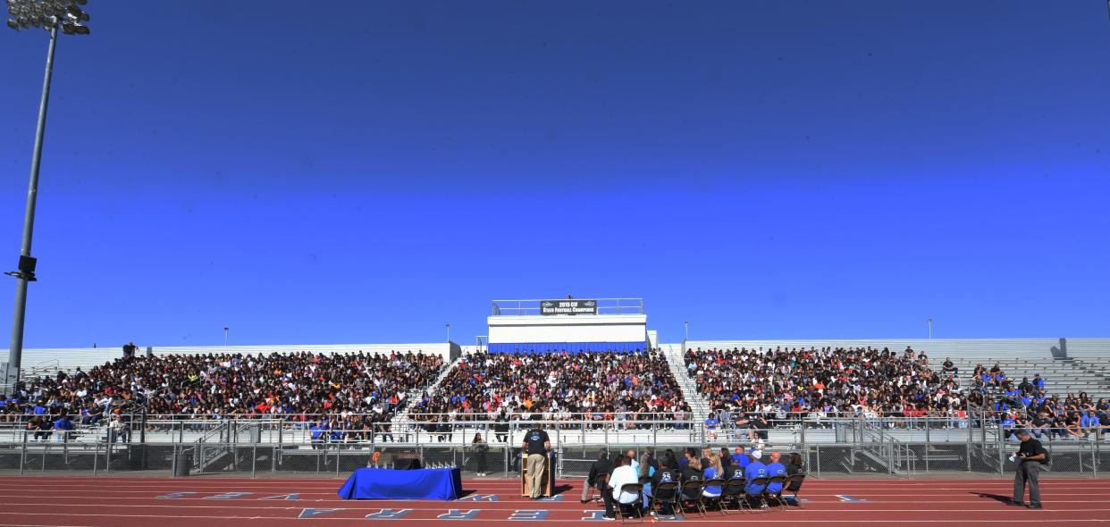 Sierra High Principal Anthony Chapman, center, addresses large crowd of 1475 students inside the Teicheira Memorial Stadium at Sierra High School for the celebration of the 25th anniversary for school opening. On Friday, Sept. 16, the stadium was closed part way through Sierra High's homecoming game following reports of a firearm sighting, police said.