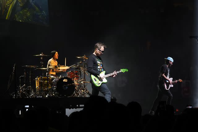 <p>Manny Carabel/Getty </p> Travis Barker, Mark Hoppus and Tom DeLonge of Blink-182 perform onstage at Madison Square Garden in May 2023