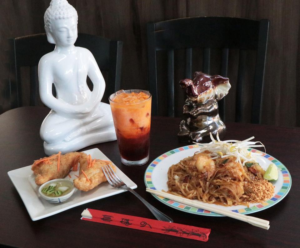 Curry Puff's mixed ground chicken,potatoes, onions & curry cooked in puffy pastry served with cucumber sause, Thai Ice Tee and Pad Thai with shrimp, rice noodles sauteed with egg, peanuts, scalions & bean sprouts, Thursday December 16, 2021 at Thai Elephant in Ormond Beach.