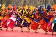 Performers dance during the Republic Day parade at a stadium in Srinagar on January 26, 2021. (Photo by Tauseef MUSTAFA / AFP) (Photo by TAUSEEF MUSTAFA/AFP via Getty Images)